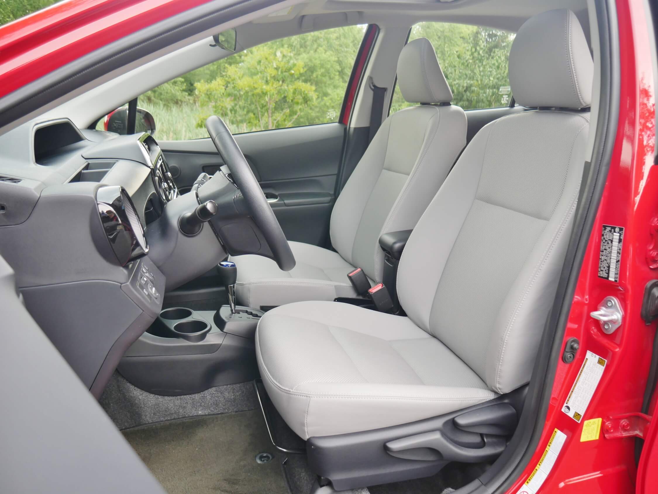 2018 Toyota Prius C Four: Leatherette seats, heated in front, w/ ample cushion aided by tilt/ telescoping steering wheel