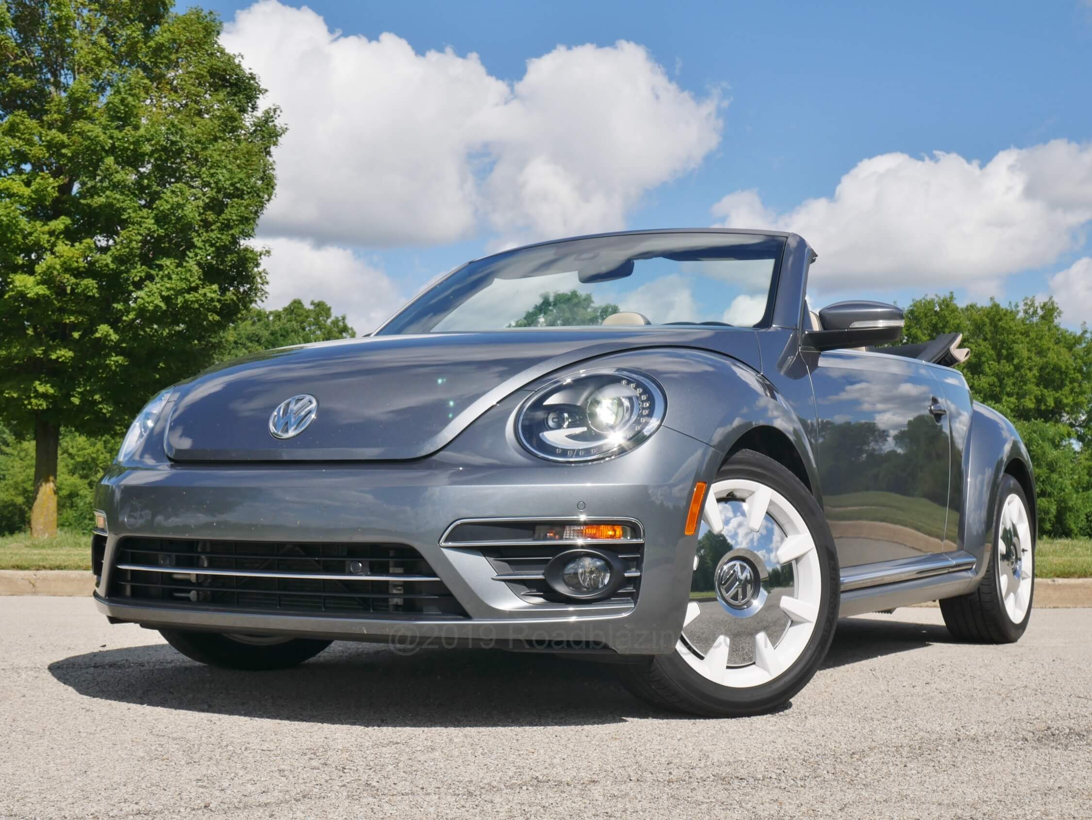 2019 Volkswagen Beetle Convertible Final Edition SEL: "Manned Up" over the previous New Beetles with more ovoid headlamps w/ LED DRLs, squared off front bumper creases, straked lower corner treatments and lower spoiler chrome character band.