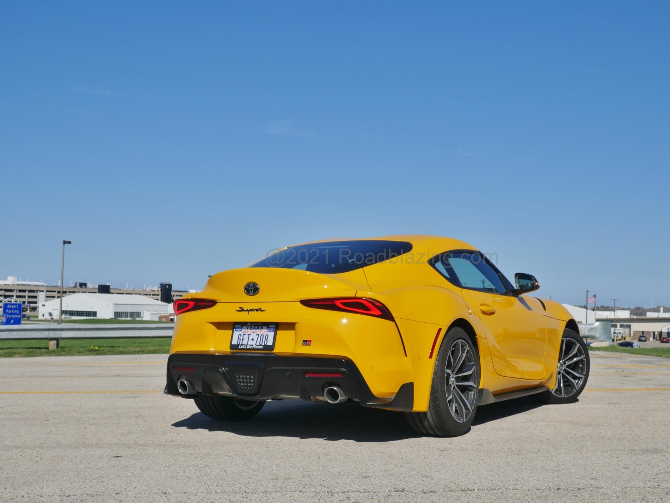 2021 Toyota Supra GR 2.0T: acute sloped, exaggerated rear quarters, prominent rear deck ducktail lid and lower rear diffuser imbue swagger