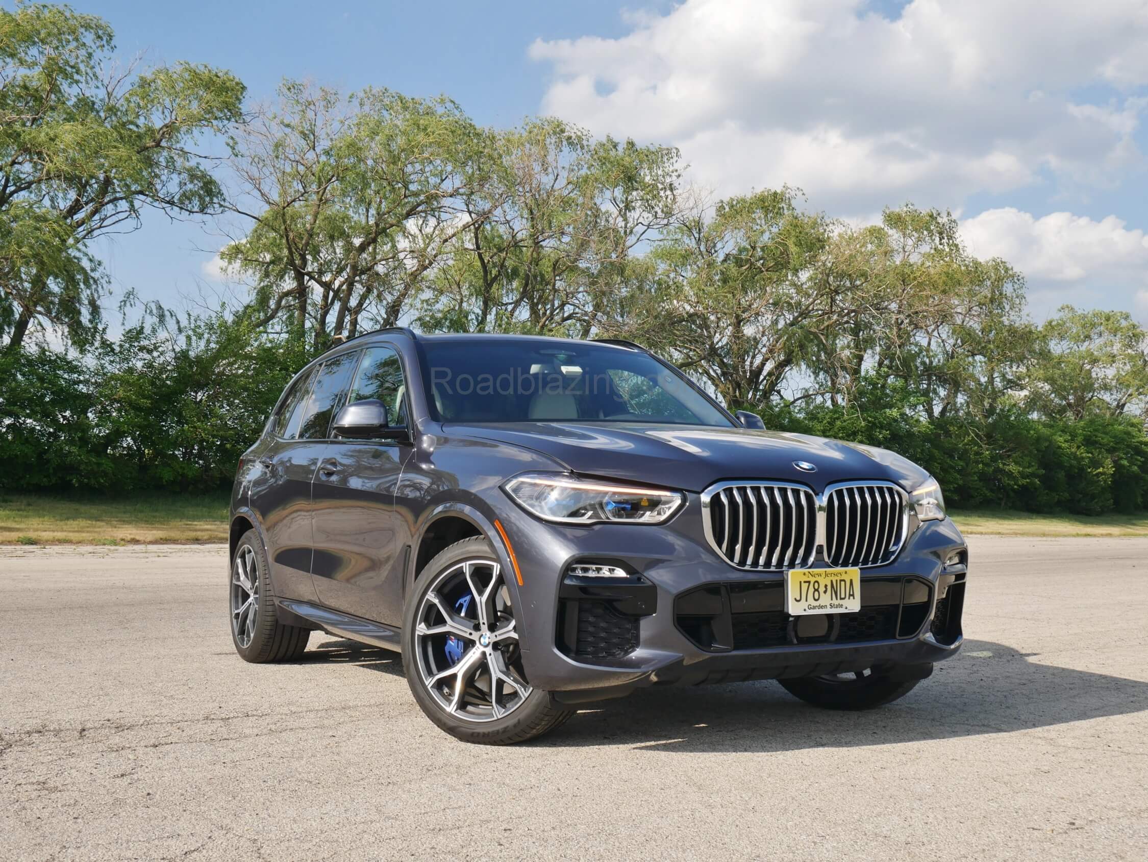 2021 BMW X5 xDrive 45e: wider fender flaring, thinner Angel eyes headlights, waterfall style twin-kidney grille & oversize lower fascia corner intakes reveal an appetite for journeys