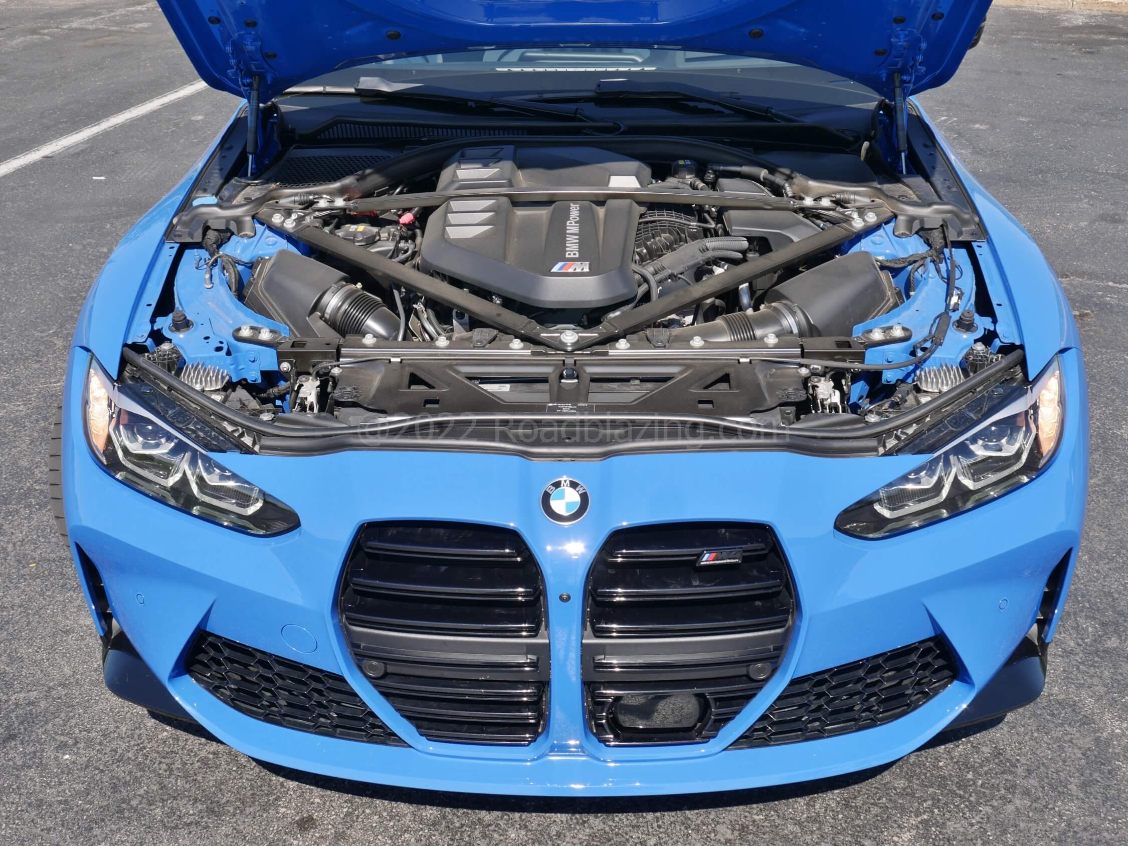 2022 BMW M4 Competition xDrive: S58B30T0 = magnificent evolution of twin-turbo twin-cam gas I-6. With ZF 8-spd. auto + AWD 60 mph arrives in an performance EV dispatching 2.9 seconds.