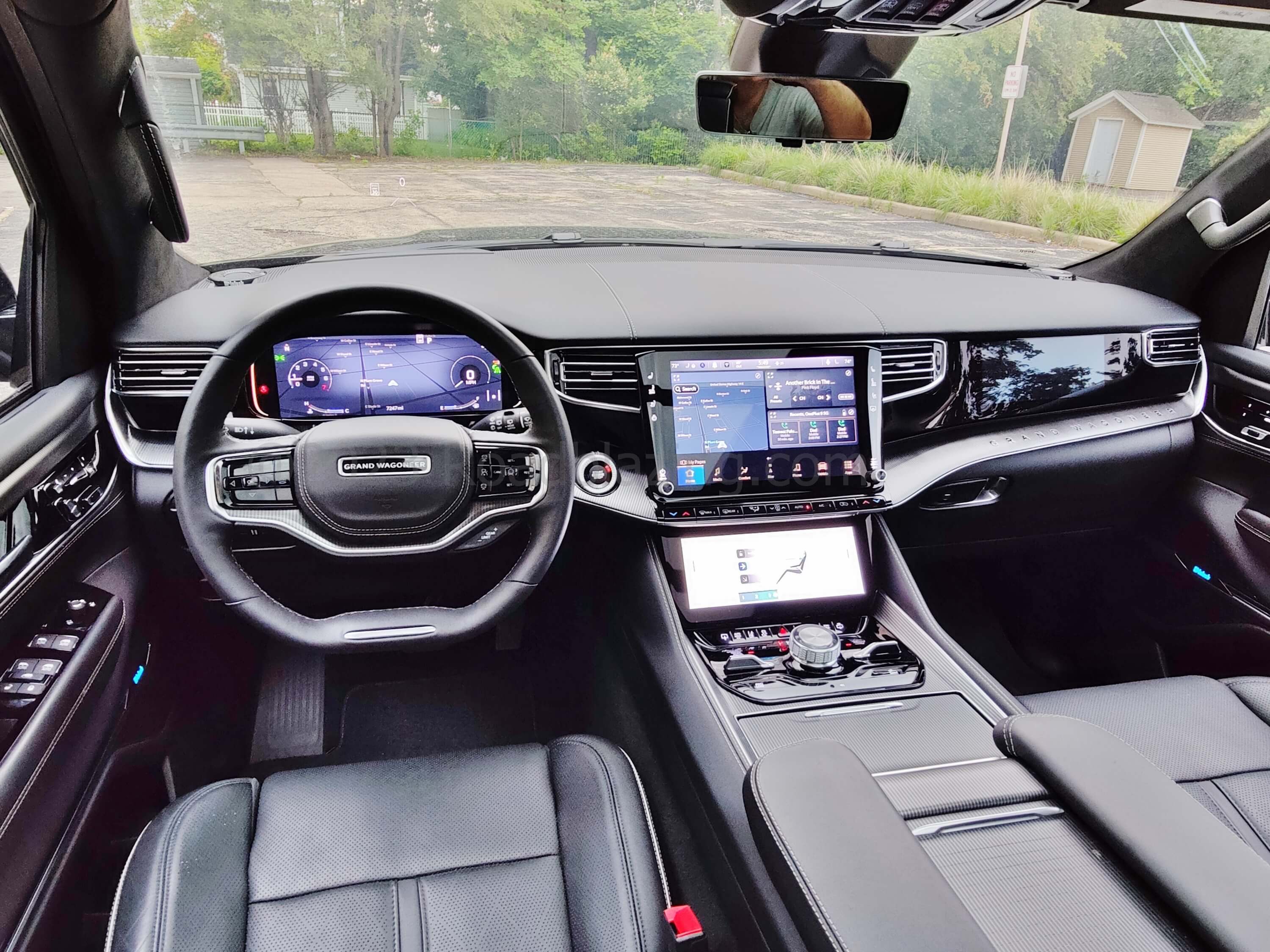 2022 Jeep Grand Wagoneer 6.4L Obsidian 4x4: Glossy glass displays, gloss piano black contrasted by smooth or turned aluminum and knurled knobs = grand cockpit